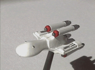 Jpeg picture of Task Force Games' 2200 Romulan Firehawk miniature.